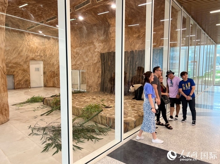 當(dāng)?shù)赜慰团c“四?！焙嫌?。人民網(wǎng)記者 張志文攝